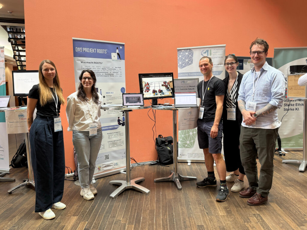 KMI-Team vor dem Stand beim WIN:A Transfertag 2026